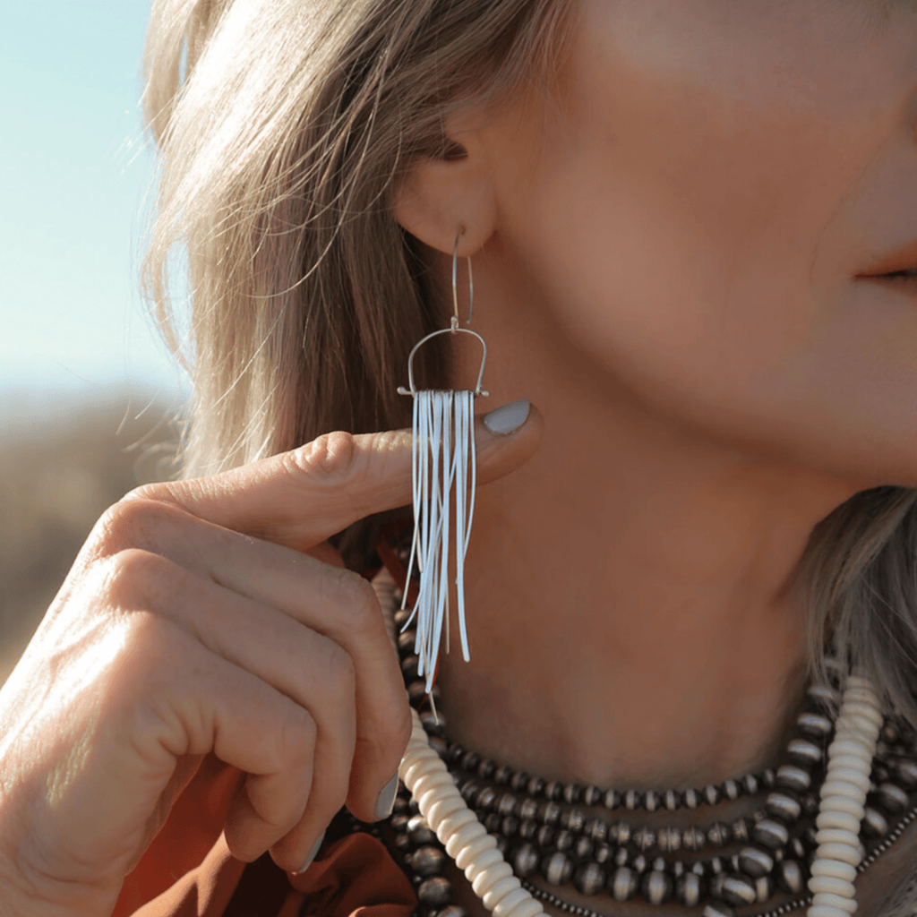 Long swinging, flowing sexy fringe silver earrings move with you and catch the light.