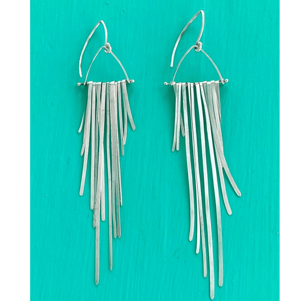 Long swinging, flowing sexy fringe silver earrings move with you and catch the light.