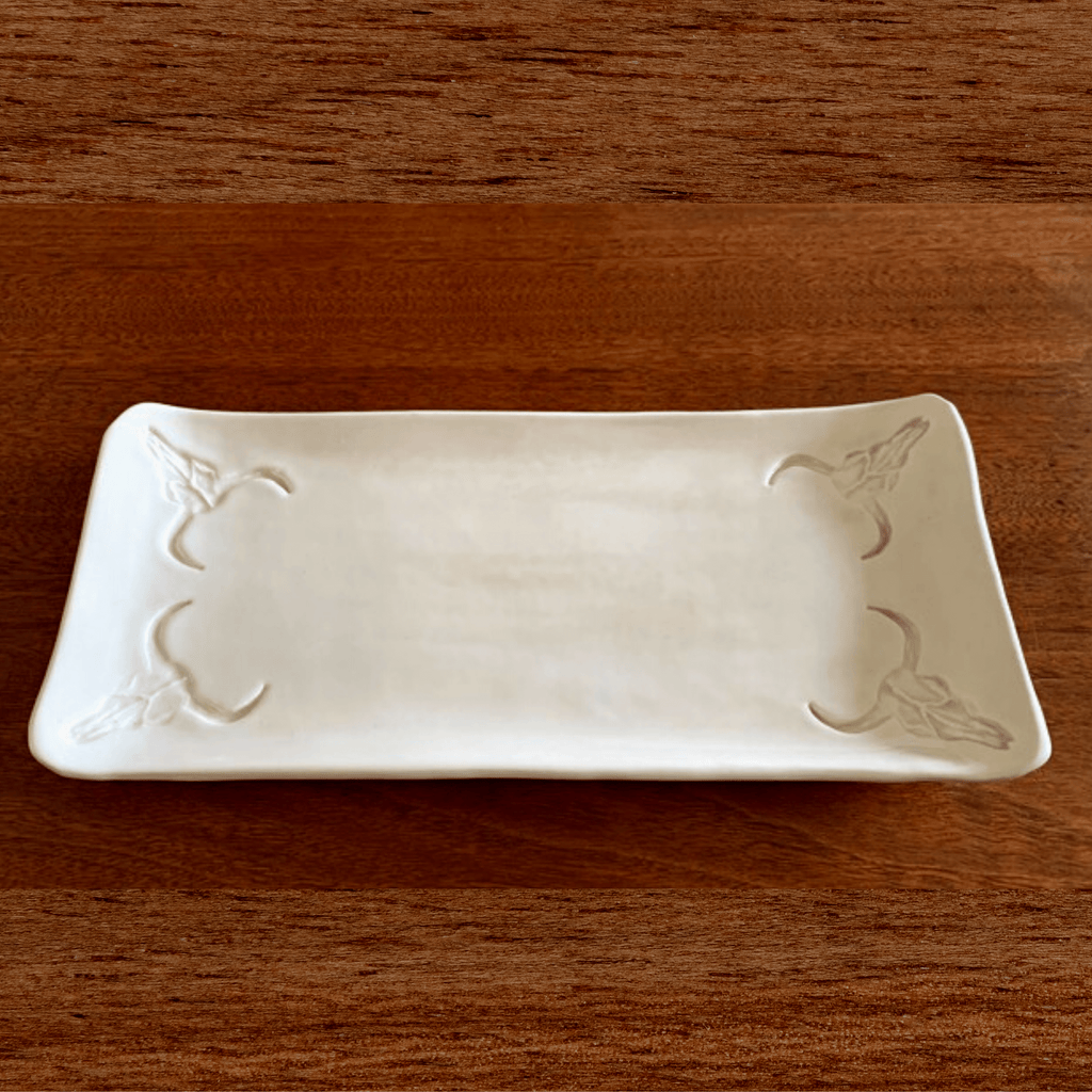 Handcrafted Long Horn Skull Serving Plate, perfect for cheeses and crackers, sweets or to simply place candles upon. Creamy natural clay body, with the use of a clear brilliant - food safe glaze