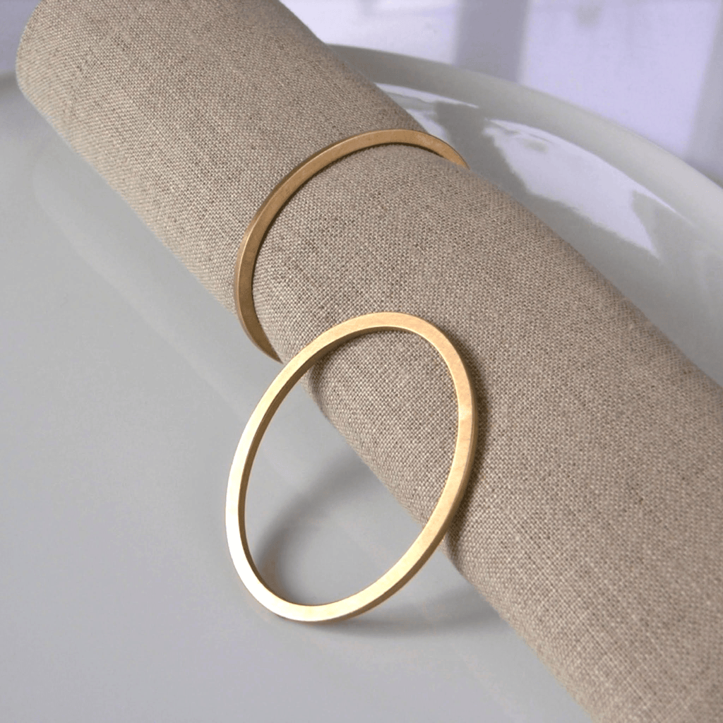 Set of four Bronze oval napkin rings for elegant table settings
