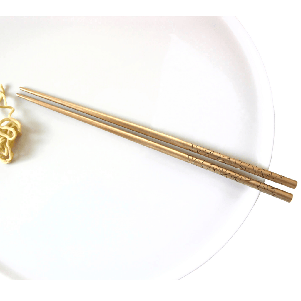 Artistic chopsticks hand cast in bronze for eating your favorite foods